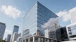 © AGI Studio - A modern glass office building reflects clouds and sky, set in an urban area with other high-rise structures under a clear blue sky.