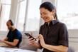 © BONNINSTUDIO/Stocksy - Woman checking smartphone screen receiving good news