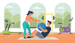 © EmilyGrace - Professional female gym trainer helping a man perform sit ups with a medicine ball in a modern fitness gym.