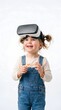 © Syahrun - Young girl wearing VR headset smiling. Child experiencing virtual reality technology. Kid enjoying futuristic gaming