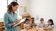 © Alva - Smiling teacher observes and guides diverse young children engaged in learning activities in a bright preschool classroom.