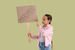 © Pixel-Shot - Protesting little girl holding placard with word IMPEACHMENT on green background