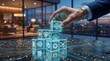 © tarik - Hand stacking AI and holographic technology data blocks in glowing circuit board office