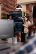 © DC Studio - Multiethnic developers discuss rising system security breaches while working on storage problems and artificial intelligence solutions.