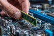 © LEEFzzzzz - Close up of a hand installing a RAM memory module into a computer motherboard