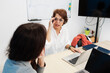 © elbuenodehal - Mature woman discussing business with colleague in office