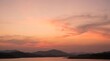 © Isolde mercer - Serene sunset over mountainous lake horizon
