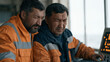 © forenna - Kazakh ergonomic workplace specialist adjusting a standing workstation configuration for a seated engineer, overcast industrial facility, Central Asia occupational health,