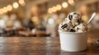 © assetsbyzed - Delicious Cookies And Cream Ice Cream Cup With Copy Space In Cozy Cafe