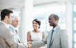 © peopleimages.com - Happy, team and handshake with client in office, thank you and agreement for investment opportunity. Corporate, investor and shaking hands with business people, collaboration and funding negotiation