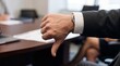 © Anusa - Businessman Showing Disapproval Gesture During Meeting With Colleagues In Modern Office Setting