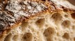 © Tgad - Extreme close-up of rustic ciabatta bread crust and airy crumb texture