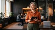 © Jasmine - European businesswoman CEO using fintech tab application standing at workplace in office. Latin Hispanic mature professional business woman holding digital tablet for trading, looking at copy space