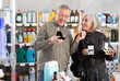 © JackF - Husband and wife choose cosmetics and perfume together in a supermarket