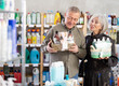 © JackF - Elderly couple chooses gifts in a supermarket for relatives and friends