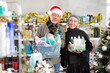 © JackF - Happy couple shopping for gifts in supermarket before celebrating Christmas