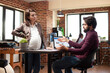 © DC Studio - Office colleagues discuss business plan together, illustrating office collaboration, company planning and expectant coworker in a professional startup setting.