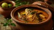 © Taisiia - Authentic Kerala fish curry served in a traditional clay pot, captured in realistic food photography that highlights the rich flavors and coastal heritage of South Indian cuisine.