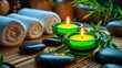 © vxnaghiyev - Still-life with spa accessoriesâ€”candles, hot stones, towel, bamboo branch.