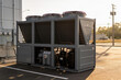 © Snide12 - Industrial chiller unit with fans and compressors on a sunny day