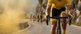 Determined cyclist in yellow jersey struggling uphill in dusty race, extreme sports competition, dynamic action shot.