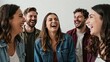 © Studicon - Group of five young adult friends sharing a joyous moment of laughter together indoors