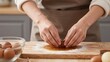© Studicon - Process of wrapping a salted egg yolk with bean paste filling for mooncake