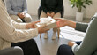 © Victoria - woman offering tissue box to another woman at group therapy session. People providing support and empathy during counseling. Mental health care concept for emotional healing and comfort