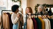 © Rendara Studio - Diverse women browsing knitwear on clothing rack in festive boutique at Christmas