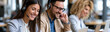 © pattozher - Customer Service Team: Three friendly customer service representatives, wearing headsets and smiling, engage with clients at their workstations. They embody professional communication and helpfulness.