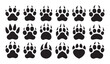 © Md Rony - Animal paw print silhouette icons set with sharp claws representing wild predators tracks.