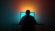 © MSTRAHIMA - Dark silhouette of a programmer coding at night with dual monitors