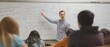 © santima - A teacher instructing students in a classroom.
