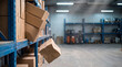© Tania Zbrodko - Falling cardboard box teetering off a warehouse shelf, representing workplace safety, supply chain risk, and logistics insurance.