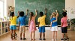 © Pamelahere - Diverse group of children writing on a classroom chalkboard