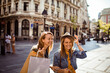 © Davor - Two happy friends shopping in historic city street