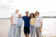 © Maria Vitkovska - Diverse teenagers enjoying outdoors together by lake