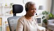 © Anna - Senior Black woman wearing headset working from home. Smiling mature African American female customer service agent in home office. Remote work and online communication concept