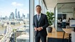 © sambath - A man in a suit standing in a modern office with a city skyline in the background.