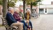 © Alexandr - Elderly Group Sitting on Park Bench in Town Square