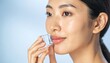 © Pesta - Woman receiving ice cube facial massage. Skincare treatment for glowing skin.