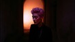 © Cyqueen - Single portrait in dim environment with warm top glow, dark background creating intimate calm