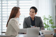 © mojo_cp - Supervisor guiding mentor training new trainee in office environment with learning focus and clarity