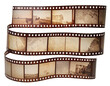 © Nuningkw - Roll of retro film strip on isolated transparent background. Photographic film in retro style. Curved film strip PNG.
