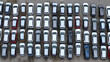 © Cavan - New SUV vehicles parked in rows at large automotive depot for import