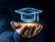 © Yuparet - Close-up business's hand, Person holding glowing digital graduation cap symbolizes business training planning learning and coaching concept with futuristic technology and innovation in education