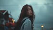 © Gajah - Young Asian woman with long hair looking back outdoors