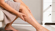 © Victoria - woman touching leg with varicose veins. Senior person experiencing calf pain and swelling in lower limb. Concept of venous insufficiency, phlebology and vascular health diagnostics