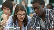 © Bussakon - Two college students focused on a chemistry experiment using glassware in a lab setting with another student observing