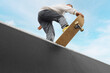 © Pixel-Shot - Young man with skateboard at skatepark
